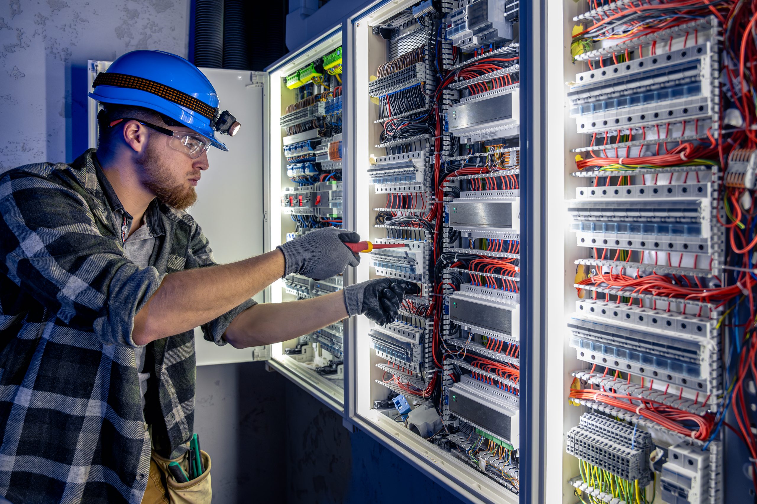 Electrical engineer working on a large panel